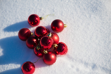 Image showing red christmas ball in fresh snow