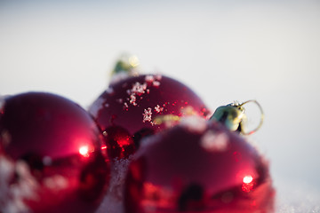 Image showing red christmas ball in fresh snow