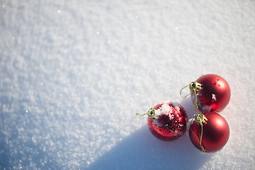 Image showing red christmas ball in fresh snow