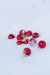 Image showing red christmas balls in fresh snow