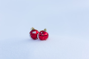 Image showing red christmas balls in fresh snow