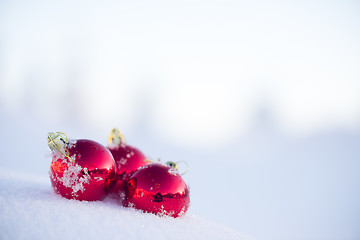 Image showing red christmas ball in fresh snow