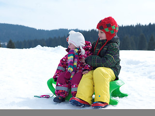 Image showing portrait of boy and baby girl on winter vacation