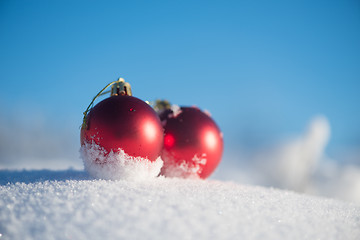 Image showing red christmas ball in fresh snow