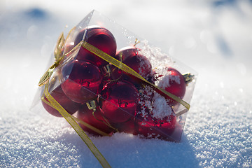 Image showing red christmas ball in fresh snow