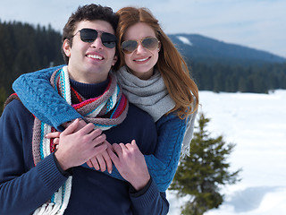 Image showing happy young couple having fun on fresh show on winter vacation