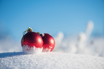 Image showing red christmas ball in fresh snow