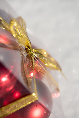 Image showing christmas ball in box on fresh  snow