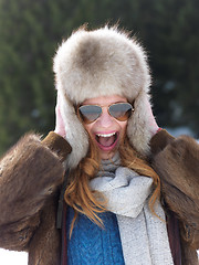 Image showing portrait of beautiful young redhair woman in snow scenery