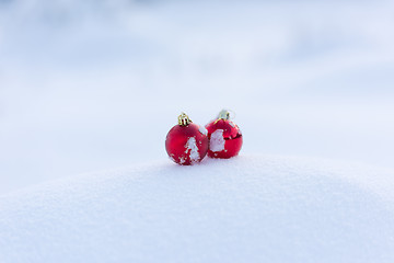 Image showing red christmas balls in fresh snow