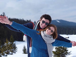 Image showing happy young couple having fun on fresh show on winter vacation