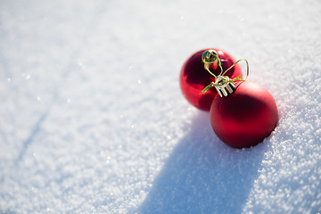 Image showing red christmas ball in fresh snow