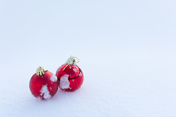 Image showing red christmas balls in fresh snow