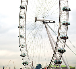 Image showing london eye in the spring sky and white clouds