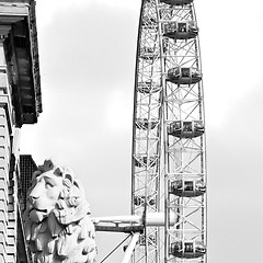 Image showing lion  london eye in the spring sky and white clouds