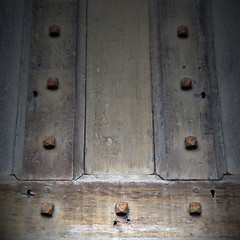 Image showing in london antique brown door  rusty  brass nail and light