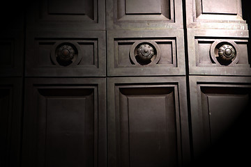 Image showing in london antique brown door  rusty  brass nail and light