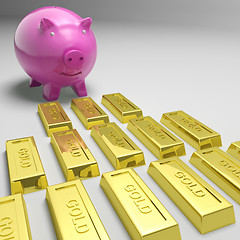 Image showing Piggybank Looking At Gold Bars Showing Gold Reserves