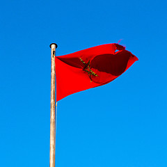 Image showing tunisia  waving flag in the blue sky  colour and battlements  wa