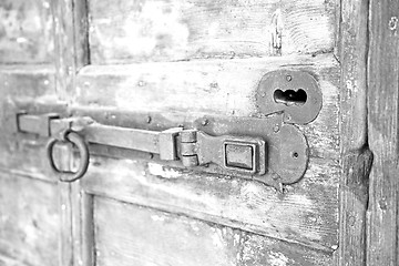 Image showing europe old in  italy  antique close brown door and rusty lock  c