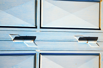 Image showing blue hinges      o in africa the old wood  facade  