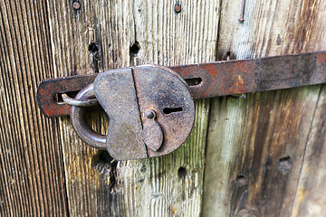 Image showing  padlock .  wooden door