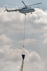 Image showing MI-8 helicopter pours out water of capacity