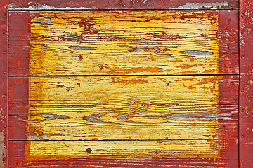 Image showing Old wooden shield with metal borders