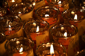 Image showing Temple candles in transparent chandeliers