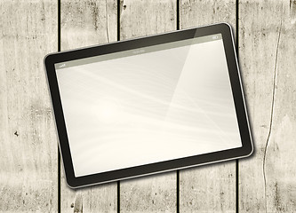 Image showing Digital tablet PC on a white wood table