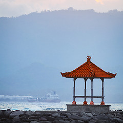 Image showing Buddhist Pagoda on a Rocky Jetty