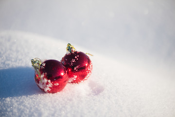 Image showing red christmas ball in fresh snow