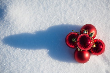 Image showing red christmas ball in fresh snow