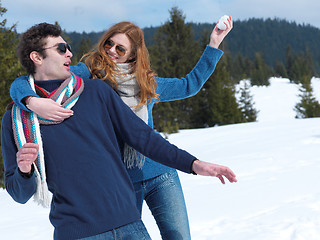 Image showing happy young couple having fun on fresh show on winter vacation