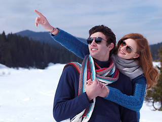 Image showing happy young couple having fun on fresh show on winter vacation