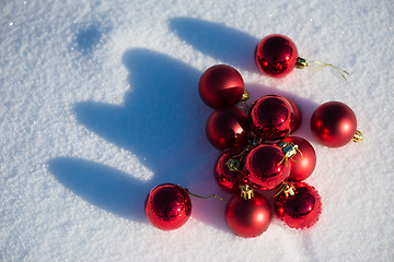 Image showing red christmas ball in fresh snow