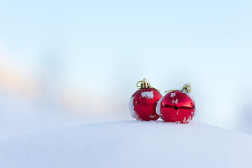 Image showing red christmas balls in fresh snow