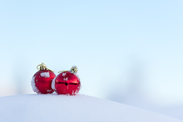 Image showing red christmas balls in fresh snow