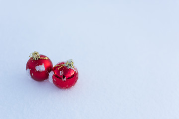 Image showing red christmas balls in fresh snow