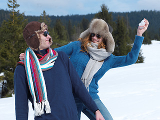 Image showing happy young couple having fun on fresh show on winter vacation