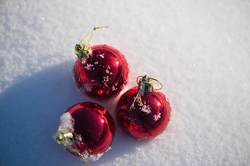 Image showing red christmas ball in fresh snow