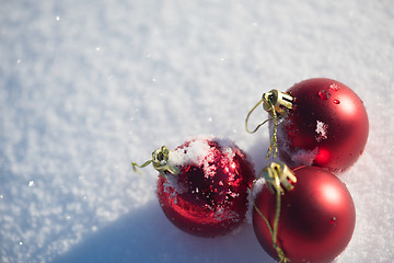 Image showing red christmas ball in fresh snow