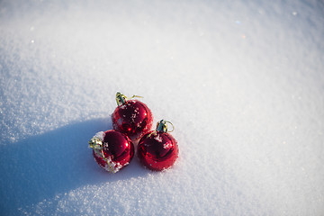 Image showing red christmas ball in fresh snow