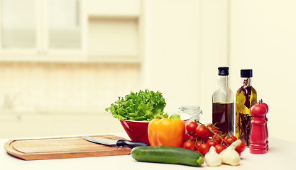 Image showing vegetables, spices and kitchenware on table