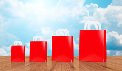 Image showing many blank red shopping bags