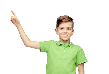 Image showing happy boy in green polo t-shirt pointing finger up