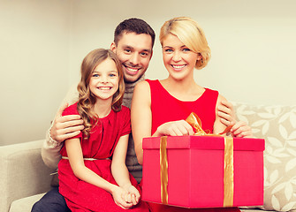 Image showing happy family opening gift box