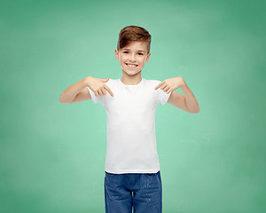 Image showing happy boy pointing finger to his white t-shirt