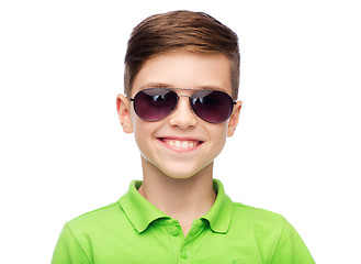 Image showing smiling boy in sunglasses and green polo t-shirt