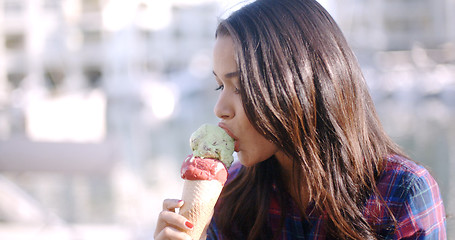 Image showing Girl Eating A Delicious Ice Cream